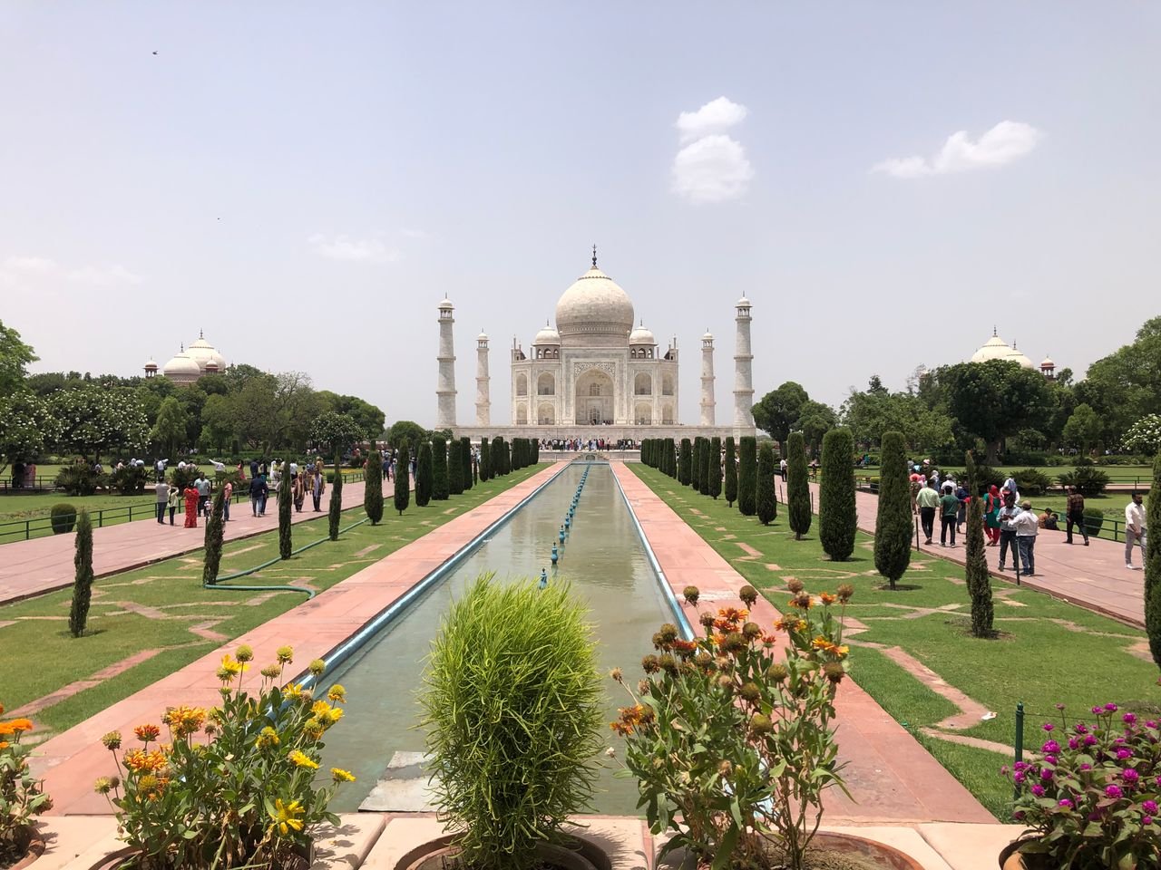 Home A captivating view of the Taj Mahal in Agra, showcasing its elegance and the surrounding gardens.